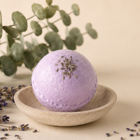 Kobi Co. #PurpleReign lavender and eucalyptus bath bomb displayed in a luxury spa-inspired setting