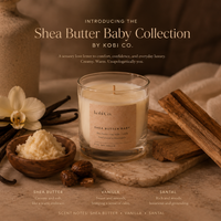 Shea Butter Baby Collection by Kobi Co. candle with vanilla beans, cinnamon sticks, and shea butter on a wooden surface.